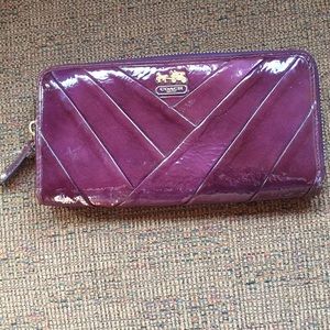 Purple leather Coach purse and wallet